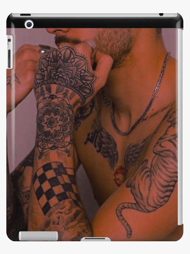 Flame addition to the ram skull tattoo on Zayn Malik's chest. Tattoo  Artist: Taboo | Zayn malik tattoos, Zayn, Zayn malik