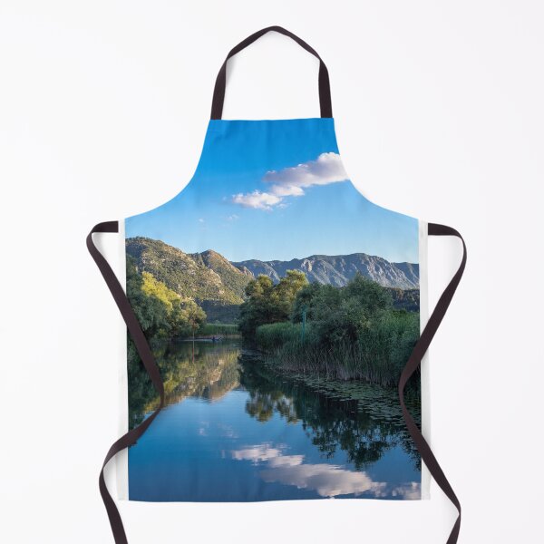 Item preview, blue sky with cloud green mountains trees and bushes and sky reflection in river water designed and sold by alinalenz.