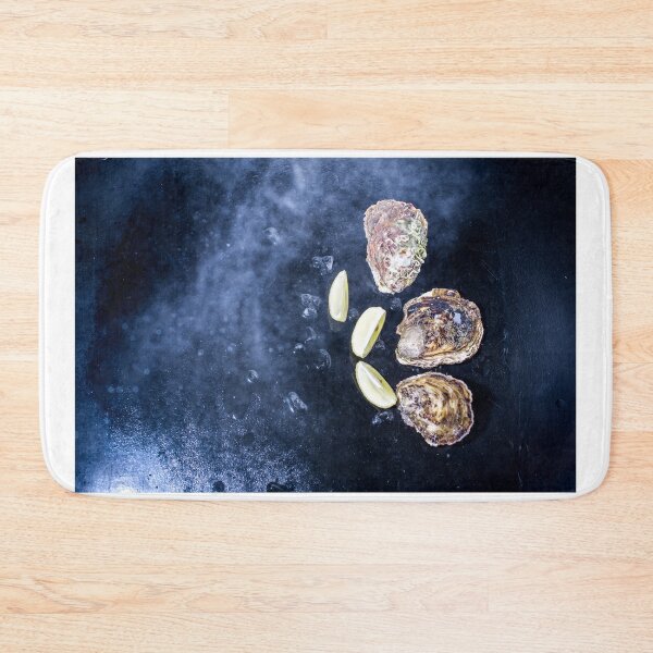 Item preview,  oysters on a black background with ice and lemon wedges designed and sold by alinalenz.