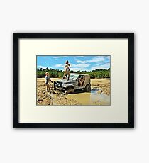 girls in mud Framed Print