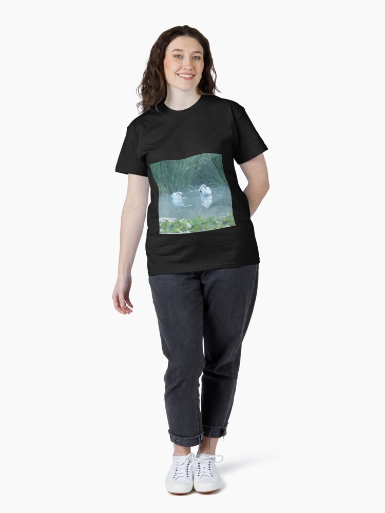 Thumbnail 4 of 7, Classic T-Shirt, Two white swans on the morning lake designed and sold by steppeland.