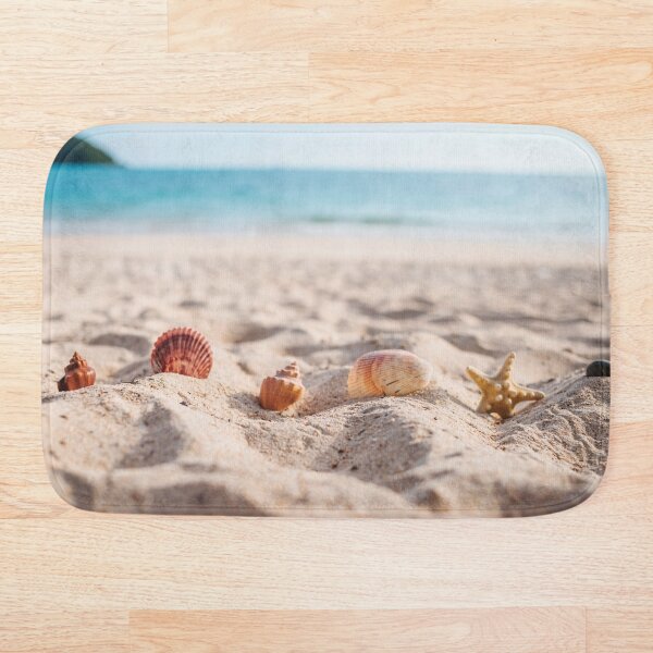 Starfish with seashells in the sand Bath Mat