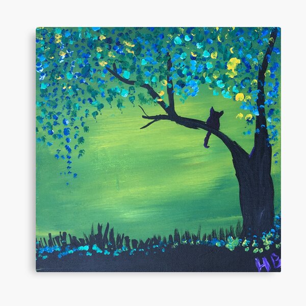 Cat on a tree branch with colorful leaves Canvas Print