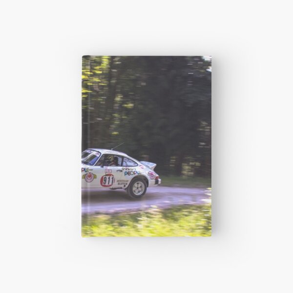 Porsche 911 jumps at Rally Goodwood Hardcover Journal