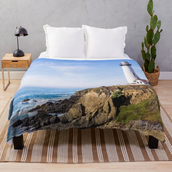 Item preview, Lighthouse on hill blue sky white house ocean designed and sold by mwagie.