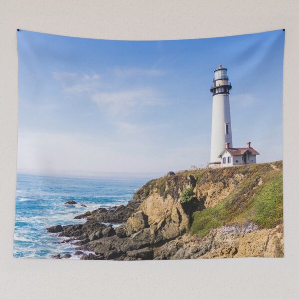 Item preview, Lighthouse on hill blue sky white house ocean designed and sold by mwagie.