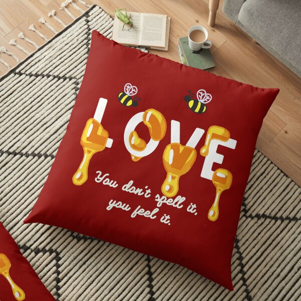 "Love you don't spell it, you feel it" in light letters Floor Pillow