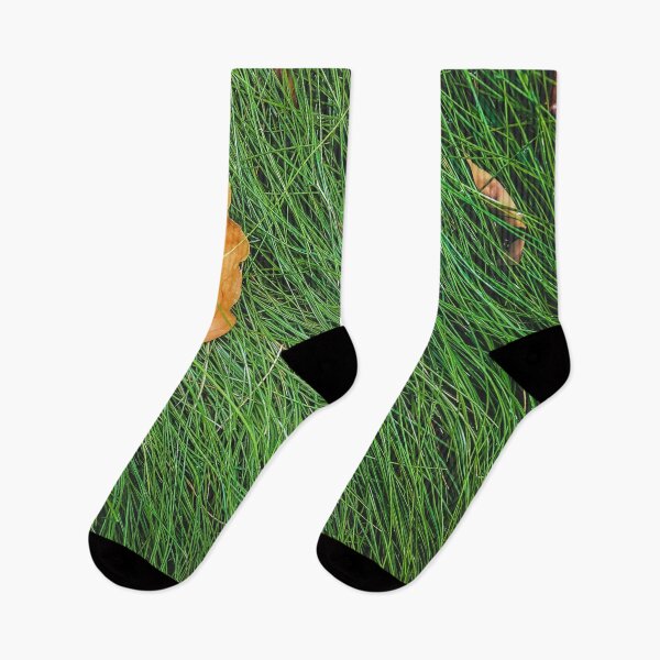 Item preview, green grass field background with dry brown leaves designed and sold by Mrvell.