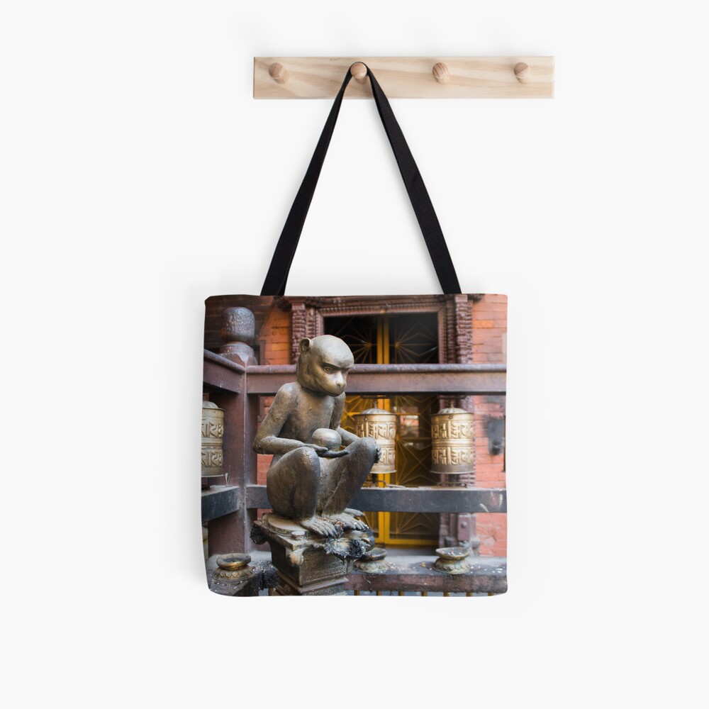 Monkey in a Buddhist temple Tote Bag