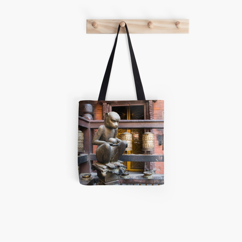 Monkey in a Buddhist temple Tote Bag