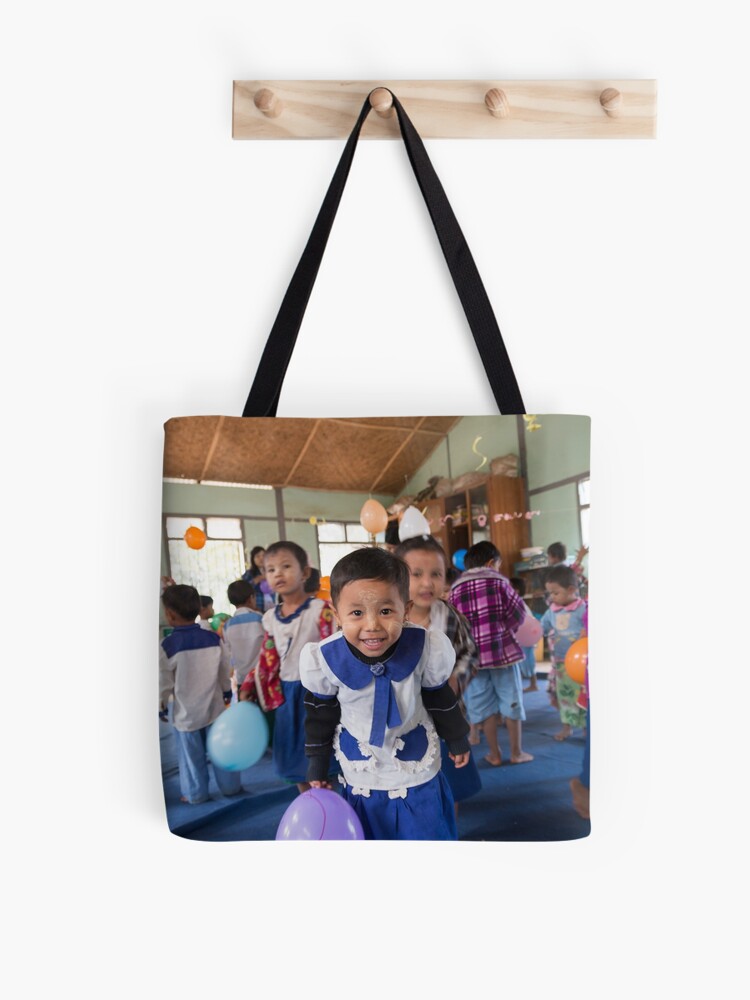 Thumbnail 1 of 2, Tote Bag, Preschoolers playing with Balloons in Myanmar designed and sold by Clara Go (missatgerebut).