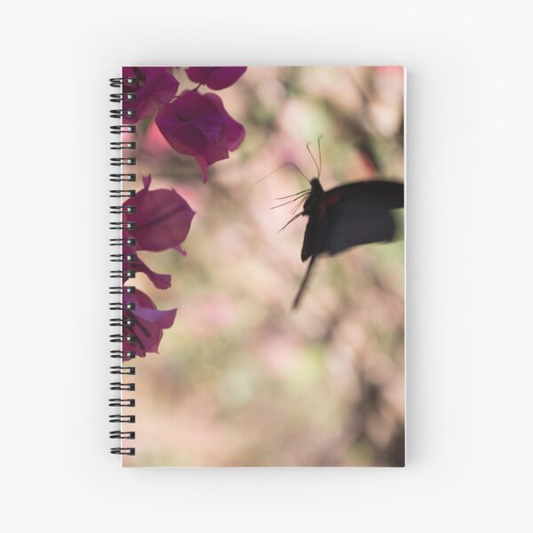 Butterfly flying over Flowers in Koh Kood Spiral Notebook