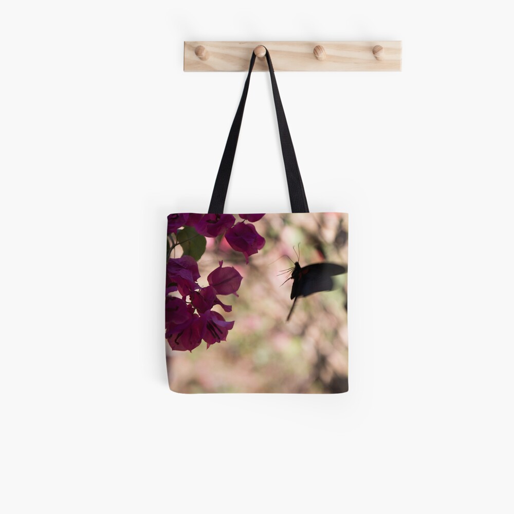 Butterfly flying over Flowers in Koh Kood Tote Bag