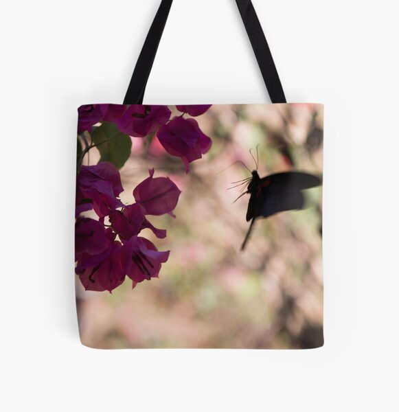 Butterfly flying over Flowers in Koh Kood All Over Print Tote Bag