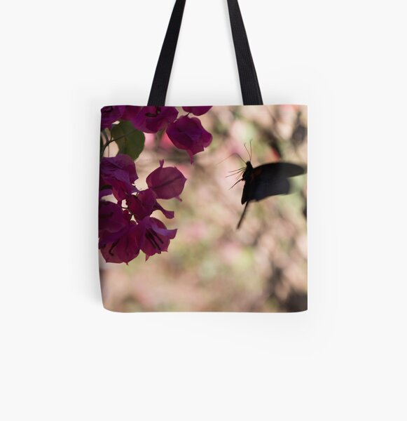 Butterfly flying over Flowers in Koh Kood All Over Print Tote Bag