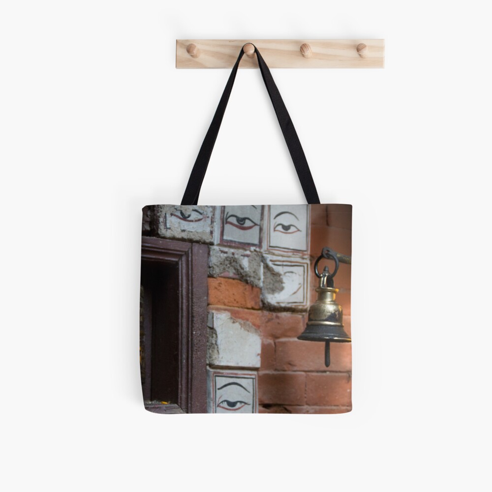 Bell and buddha eyes in a buddhist temple Tote Bag