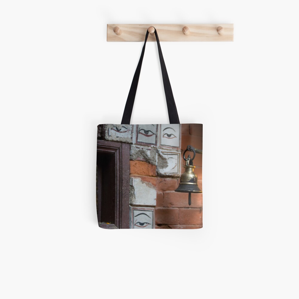Bell and buddha eyes in a buddhist temple Tote Bag