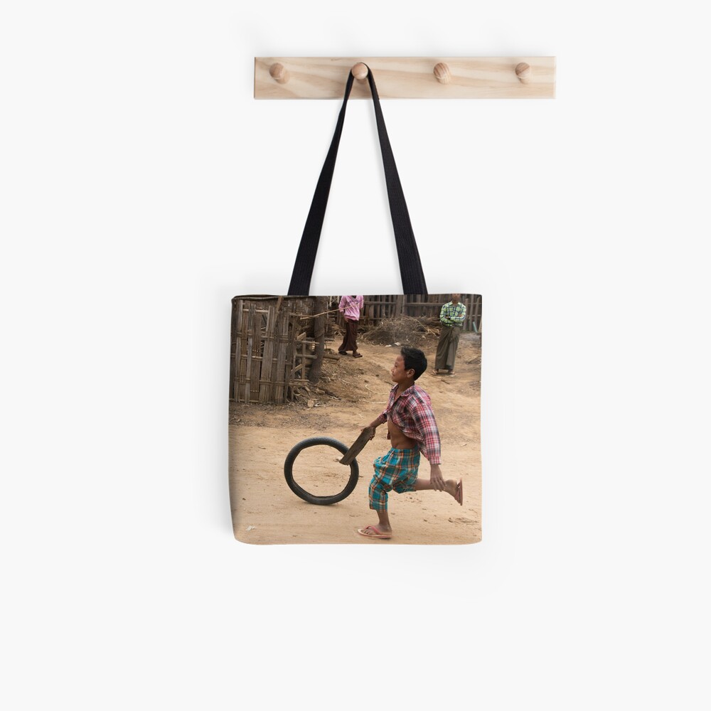 A Child Playing With A Wheel in Myanmar Tote Bag