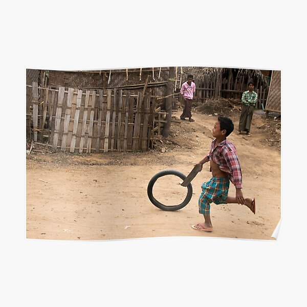 A Child Playing With A Wheel in Myanmar Poster