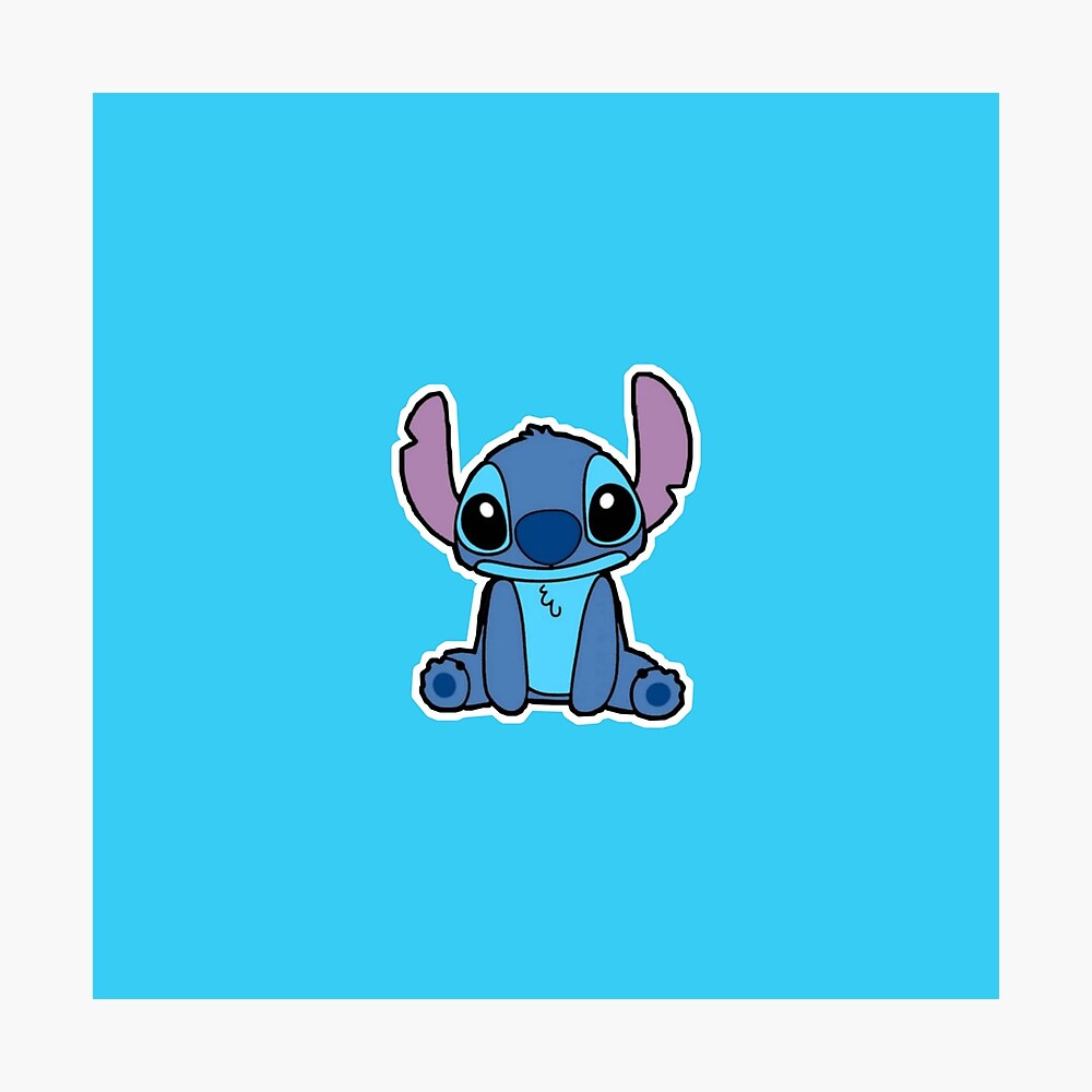 Download Stitchy Is Sitting On A Blue Background With A Heart Wallpaper