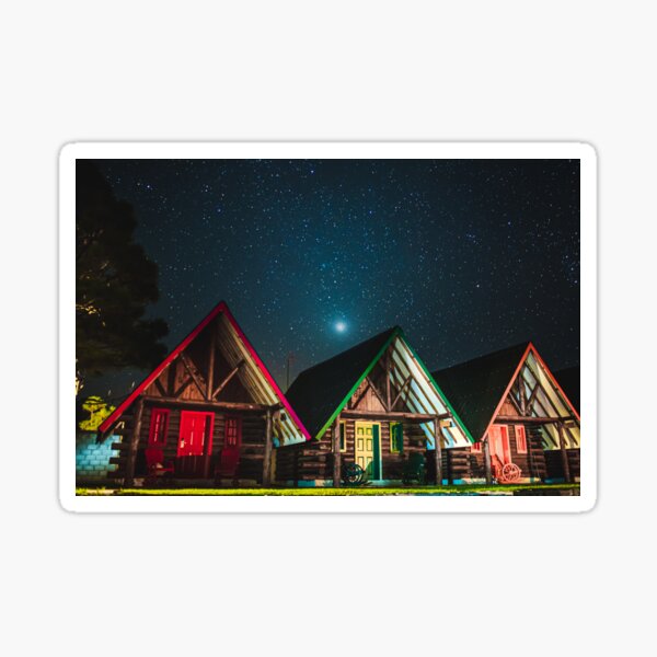 Peaceful landscape of cottages under the starry sky. Sticker