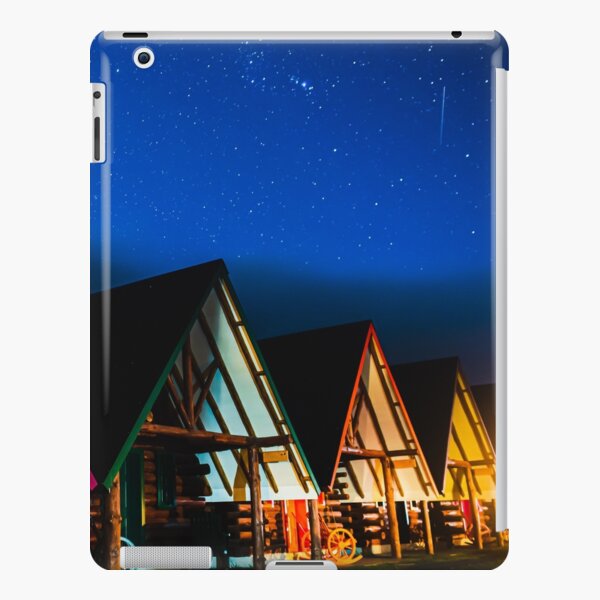 A shooting star below the mountain cabins iPad Snap Case