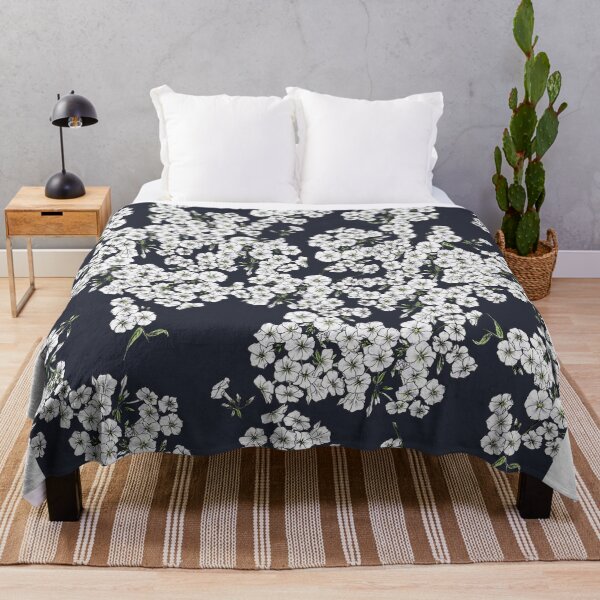 Item preview, Small white flowers on a black background designed and sold by Olga Shashok.