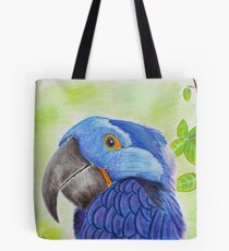 Blue Smiling Parrot on Green leaves Background Tote Bag