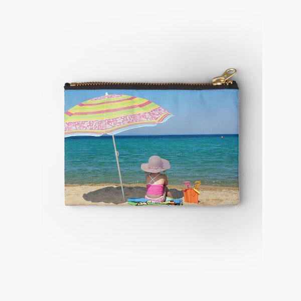 Item preview, little girl sitting on beach under sunshade designed and sold by goceris.