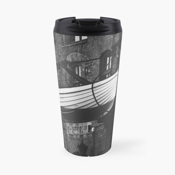 A boat and the wall Travel Mug
