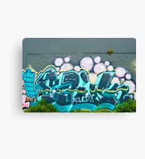 Abstract Graffiti on the textured brick wall Canvas Print