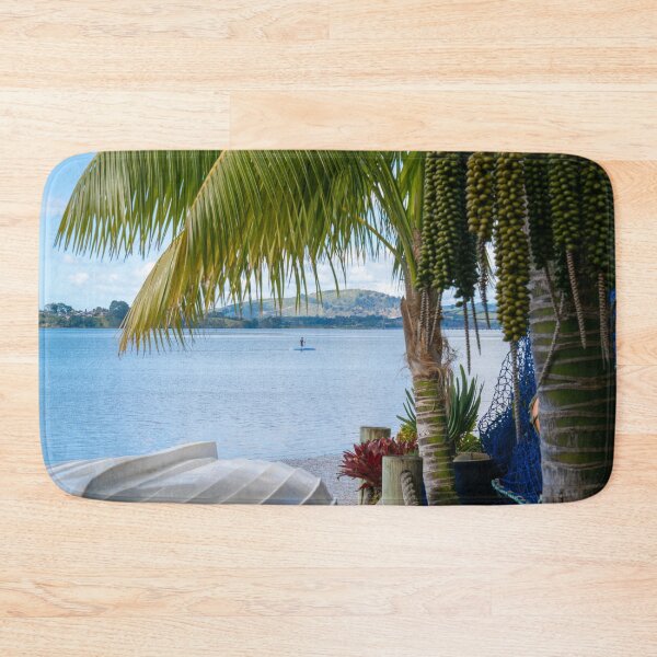 Item preview, Tropical garden frames view over white clinker dinghy to bay with stand-up paddle-boarder in distance. designed and sold by Brian Scantlebury.