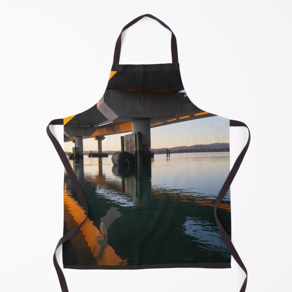 Item preview, Morning sun strikes side Tauranga Harbour Bridge in golden hue reflected leading lines into calm water below  designed and sold by Brian Scantlebury.