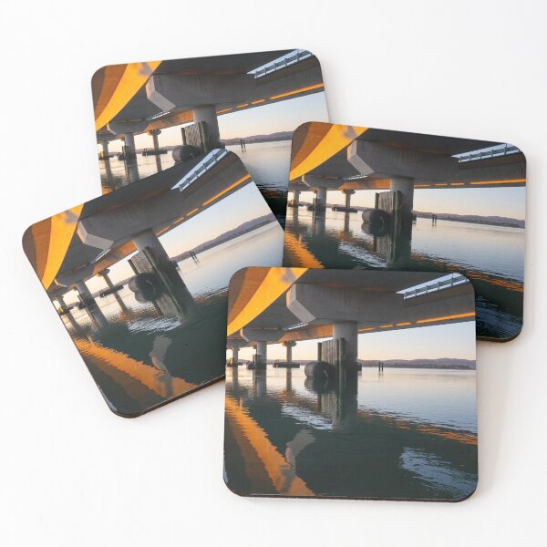 Item preview, Morning sun strikes side Tauranga Harbour Bridge in golden hue reflected leading lines into calm water below  designed and sold by Brian Scantlebury.
