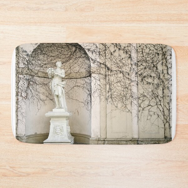 Item preview, Statue and wall with creeper plant in Vienna Austria autumn season designed and sold by goceris.