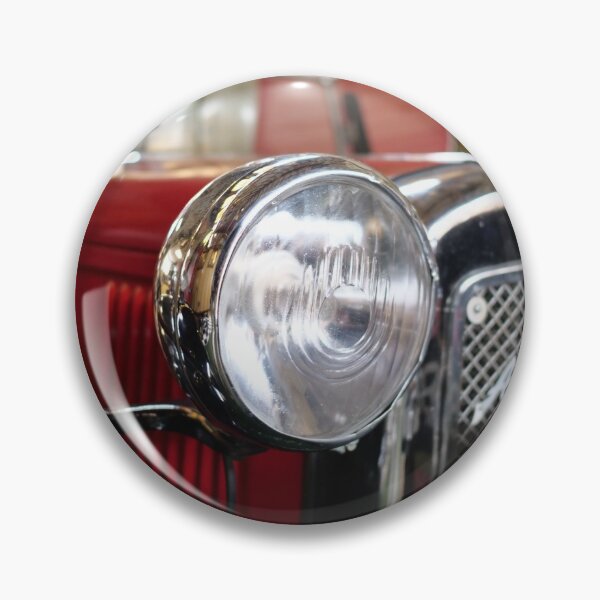 Item preview, Head light of a vintage red car with background blur designed and sold by santoshputhran.