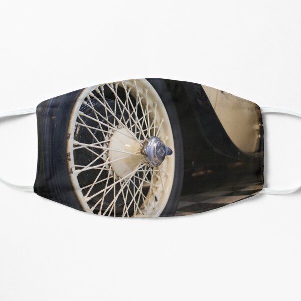 Old spoke wheel of vintage car in cream colour Mask