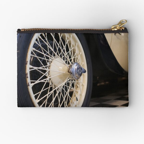Old spoke wheel of vintage car in cream colour Zipper Pouch