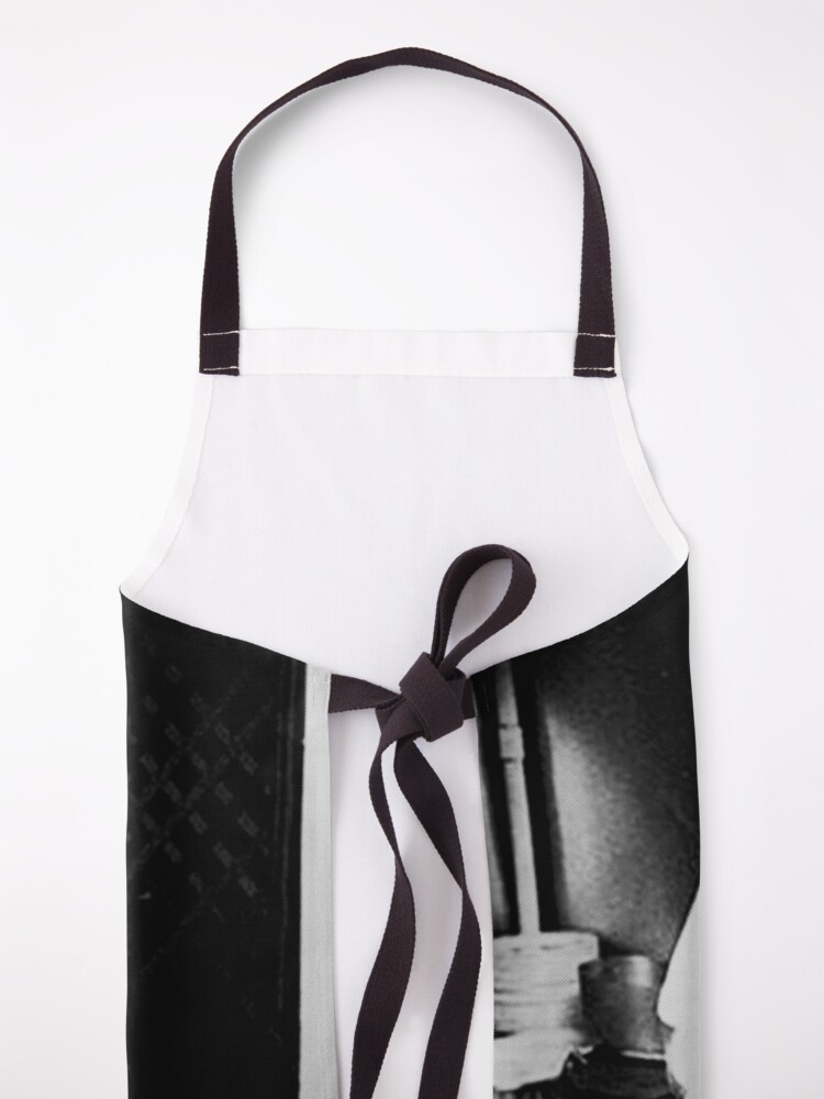 Alternate view of young Anthony Bourdain preparing sushi rolls Apron