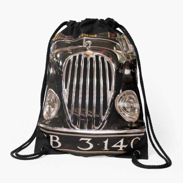 Stare at the black classic car headlights Drawstring Bag