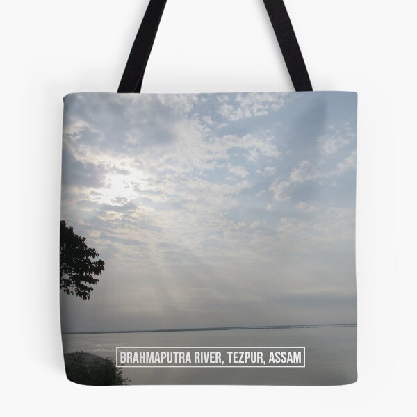 Item preview, Sunlight Passing Through The Clouds Into The Brahmaputra River In Tezpur, Assam designed and sold by funnierthanthou.