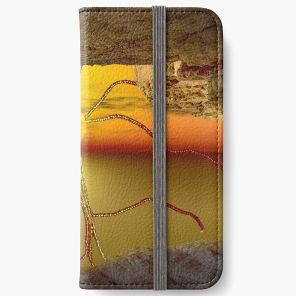Sunset view from a cave with beaded sunrays iPhone Wallet