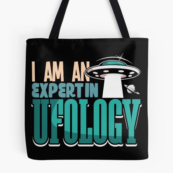 Item preview, I Am an Expert in Ufology  alien shirt design designed and sold by Grinover.