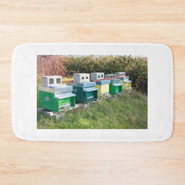 Item preview, beekeeping and hives in a row of colorful bee houses designed and sold by alessiapenny.