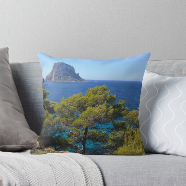 Item preview, The solitary islet of Es Vedra in contrast against the blue sea of ​​Ibiza immersed in the green and arid wild nature in Spain designed and sold by alessiapenny.