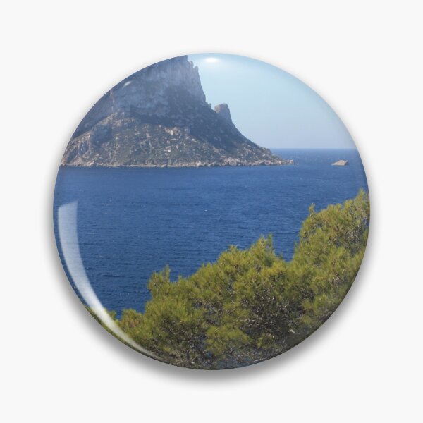Item preview, The solitary islet of Es Vedra in contrast against the blue sea of ​​Ibiza immersed in the green and arid wild nature in Spain designed and sold by alessiapenny.