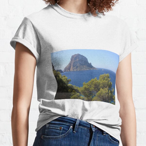 Item preview, The solitary islet of Es Vedra in contrast against the blue sea of ​​Ibiza immersed in the green and arid wild nature in Spain designed and sold by alessiapenny.