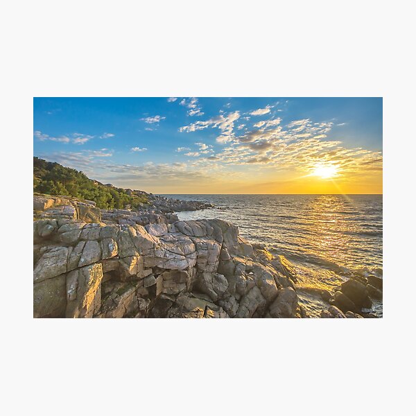 Stunning sunset over ocean and cliffs Photographic Print