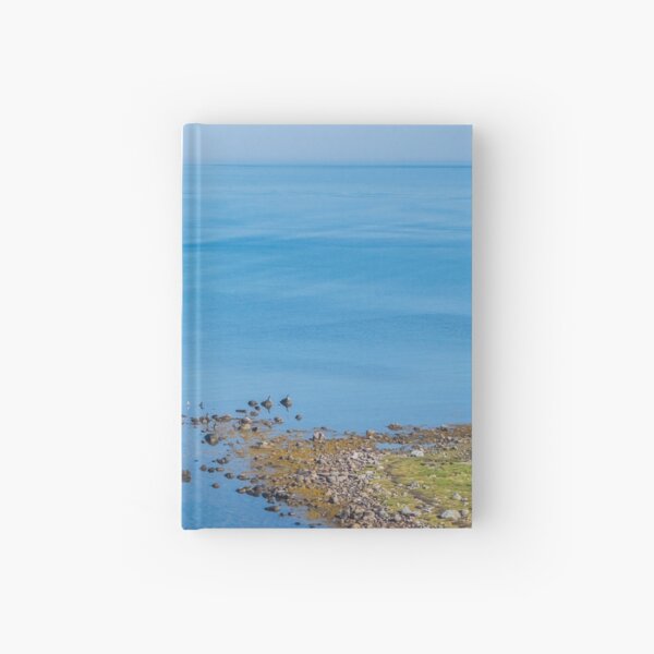 Coastlines frame the blue sea Hardcover Journal