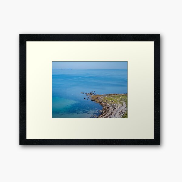 Coastlines frame the blue sea Framed Art Print